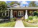 Charming single Gathering home with a landscaped front yard and an inviting front porch with fall decor at 1740 Wilmore Dr, Charlotte, NC 28203