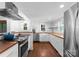 Well-lit kitchen featuring stainless steel appliances, a subway tile backsplash, and butcher block countertops at 1740 Wilmore Dr, Charlotte, NC 28203