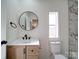 Bathroom with vanity, toilet, and marble shower at 204 Regency Rd, Mooresville, NC 28117