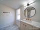 Modern bathroom with marble flooring and a large vanity at 204 Regency Rd, Mooresville, NC 28117