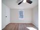 Bright bedroom with wood floors, ceiling fan, and window at 204 Regency Rd, Mooresville, NC 28117