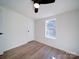 Bright bedroom with wood floors, ceiling fan, and window at 204 Regency Rd, Mooresville, NC 28117