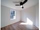 Bright bedroom with wood floors, ceiling fan, and window at 204 Regency Rd, Mooresville, NC 28117