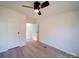 Bright bedroom with wood floors, ceiling fan, and window at 204 Regency Rd, Mooresville, NC 28117