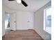 Bright bedroom with wood floors, ceiling fan, and window at 204 Regency Rd, Mooresville, NC 28117