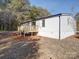 Spacious deck with wooden railings and wooded backdrop at 204 Regency Rd, Mooresville, NC 28117