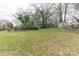 Large backyard with storage shed and mature trees at 2541 Pinewood Rd, Gastonia, NC 28054