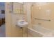 Clean bathroom with a shower/tub combo, vanity sink, and grab bar at 2541 Pinewood Rd, Gastonia, NC 28054