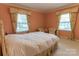 Charming bedroom with two windows, and neutral wall color at 2541 Pinewood Rd, Gastonia, NC 28054