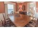 Classic dining room with a wooden table and view into the kitchen at 2541 Pinewood Rd, Gastonia, NC 28054