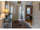 Welcoming entryway featuring a console table and area rug at 2541 Pinewood Rd, Gastonia, NC 28054