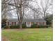 Ranch style brick home with a spacious front yard at 2541 Pinewood Rd, Gastonia, NC 28054