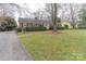 Brick house with driveway and landscaped lawn at 2541 Pinewood Rd, Gastonia, NC 28054