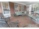 Spacious screened porch, brick floor, metal furniture at 2541 Pinewood Rd, Gastonia, NC 28054