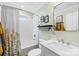 Well-lit bathroom with a shower-tub combination, modern vanity, and stylish decor for a comfortable and clean feel at 27 Dove Sw Ave, Concord, NC 28025