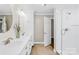 Bright bathroom with double sink vanity, walk-in shower, and neutral tones, creating a clean and open feel at 27 Dove Sw Ave, Concord, NC 28025