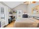 Bright bedroom featuring hardwood floors, a ceiling fan, and a functional workspace with a desk and printer at 27 Dove Sw Ave, Concord, NC 28025