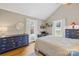 Comfortable bedroom with vaulted ceiling features windows on two sides and classic furnishings at 27 Dove Sw Ave, Concord, NC 28025