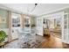 Charming dining area with a glass table, white chairs, and natural light at 27 Dove Sw Ave, Concord, NC 28025