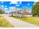 Charming exterior featuring a well-maintained lawn and a long driveway leading to the home at 27 Dove Sw Ave, Concord, NC 28025