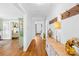 Inviting hallway showcases hardwood floors, neutral paint, and flows to living areas at 27 Dove Sw Ave, Concord, NC 28025