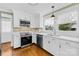 Well-equipped kitchen boasts stainless steel appliances, bright lighting, and ample counter space for meal preparation at 27 Dove Sw Ave, Concord, NC 28025