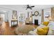 Bright living room featuring a fireplace, decorative rug, and comfortable seating at 27 Dove Sw Ave, Concord, NC 28025