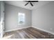 Bedroom features wood-look floors and bright window at 2832 12Th Sw Ave, Hickory, NC 28602