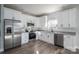 Open kitchen featuring stainless steel appliances, granite counters and shaker style cabinets at 2832 12Th Sw Ave, Hickory, NC 28602