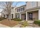 Charming townhome with brick accents, a cozy porch, and well-maintained landscaping at 3028 Summerfield Ridge Ln, Matthews, NC 28105