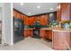 Modern kitchen with stainless steel appliances, wooden cabinets, and ample counter space at 3028 Summerfield Ridge Ln, Matthews, NC 28105