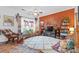 Inviting living room featuring bright natural light, cozy furniture, and decorative plants at 3028 Summerfield Ridge Ln, Matthews, NC 28105