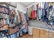 Large walk-in closet with built-in shelving and hanging rods for ample storage at 3028 Summerfield Ridge Ln, Matthews, NC 28105