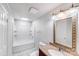 View of a bathroom with bathtub and shower, sink and mirror at 3029 Winding Trl, Matthews, NC 28105