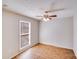 A view of a bedroom with a window, ceiling fan, and wood flooring at 3029 Winding Trl, Matthews, NC 28105