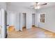 Bedroom featuring three closets, one window and laminate flooring at 3029 Winding Trl, Matthews, NC 28105