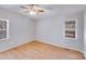 Bedroom featuring two windows and laminate flooring at 3029 Winding Trl, Matthews, NC 28105