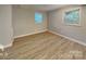 Well-lit bedroom with hardwood floors and window at 3029 Winding Trl, Matthews, NC 28105