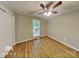 Bedroom with hardwood floors and a closet at 3029 Winding Trl, Matthews, NC 28105