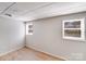 Cozy bedroom with modern laminate flooring and two windows, offering ample light at 3029 Winding Trl, Matthews, NC 28105