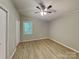 Bedroom with ceiling fan and new wood flooring at 3029 Winding Trl, Matthews, NC 28105