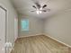 Bedroom with hardwood floors and ceiling fan at 3029 Winding Trl, Matthews, NC 28105