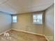 Simple bedroom with two windows and hardwood floors at 3029 Winding Trl, Matthews, NC 28105