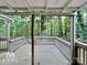 Deck with wooded view and stairs leading down at 3029 Winding Trl, Matthews, NC 28105