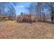 Backyard featuring the deck and mature trees, and the home's siding at 3029 Winding Trl, Matthews, NC 28105