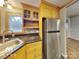 Kitchen with stainless steel refrigerator and oak cabinets at 3029 Winding Trl, Matthews, NC 28105