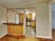 Modern kitchen with stainless appliances, stone countertops, and a connecting bar area at 3029 Winding Trl, Matthews, NC 28105