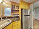 Well-lit kitchen featuring wood cabinets, granite countertops, stainless steel appliances at 3029 Winding Trl, Matthews, NC 28105