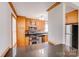 View of the kitchen with stainless steel appliances and wooden cabinets at 3029 Winding Trl, Matthews, NC 28105