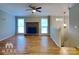 Living room with fireplace, hardwood floors, and neutral walls at 3029 Winding Trl, Matthews, NC 28105